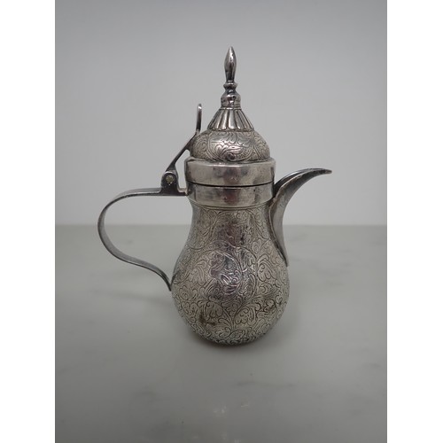 119 - A pair of Eastern silver hexagonal lidded Pots, leafage scroll engraved, a small Indian Coffee Pot, ... 