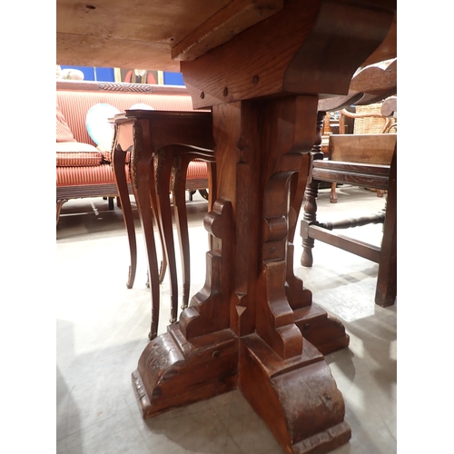 575 - A burr oak Refectory Table in 16th Century style with three plank cleated top raised on two cross-fo... 