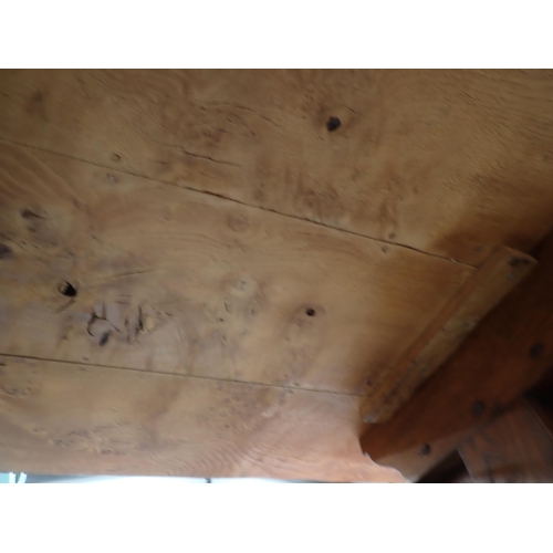 575 - A burr oak Refectory Table in 16th Century style with three plank cleated top raised on two cross-fo... 