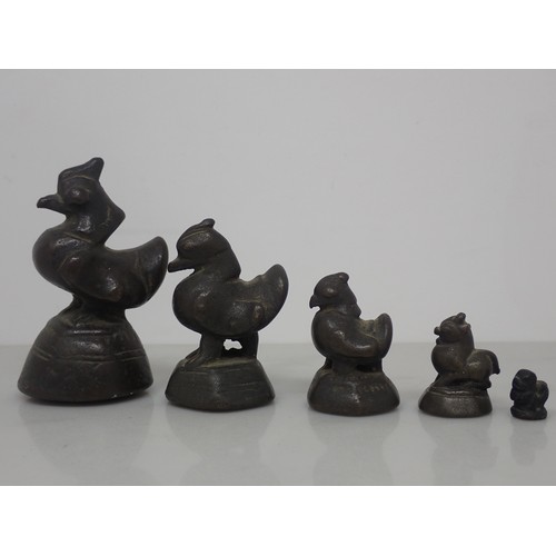 390 - A set of five Asian bronze graduated Weighs in the form of birds, 7cm to 1cm, a cast Bottle Open in ... 