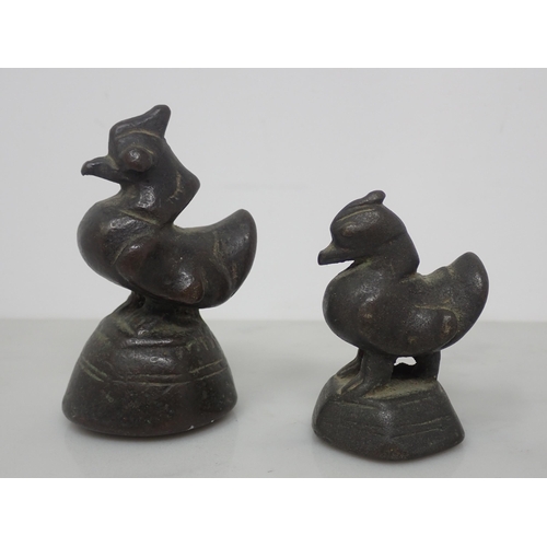 390 - A set of five Asian bronze graduated Weighs in the form of birds, 7cm to 1cm, a cast Bottle Open in ... 