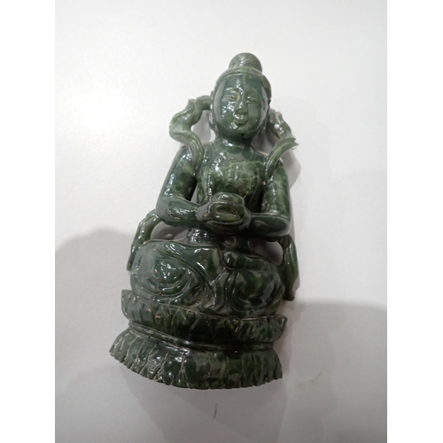 402 - A carved greenstone Figure of a Buddha on carved wooden stand 6in H, an Eastern carved stone Figure ... 