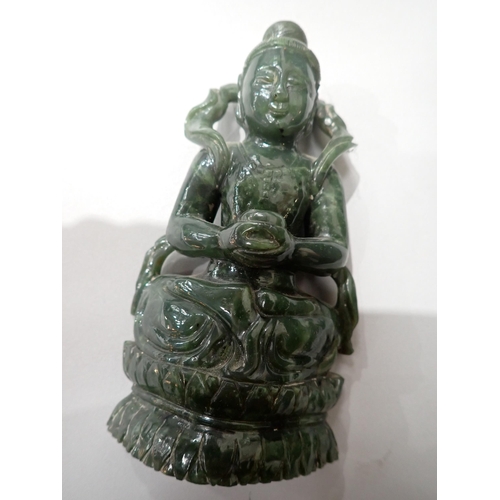 402 - A carved greenstone Figure of a Buddha on carved wooden stand 6in H, an Eastern carved stone Figure ... 