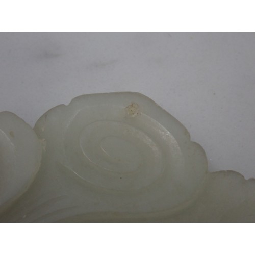 412 - A Chinese celadon Jade Bi Disk carved flower head with geometric carved centre section on hardwood s... 