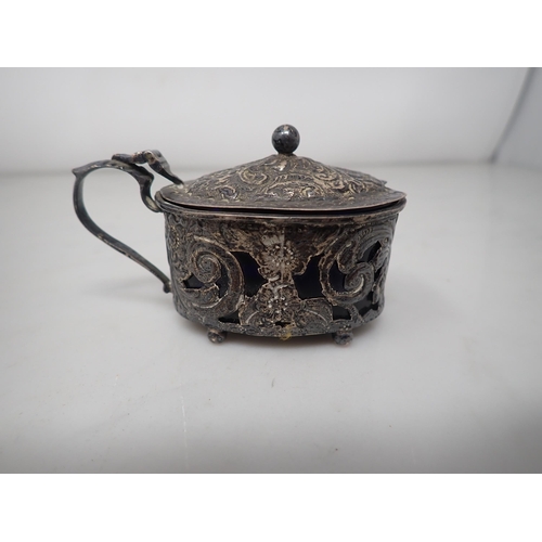 125 - An Edward VII silver oval Mustard Pot with floral embossing, Birmingham 1901, a Prayer Book, Birming... 