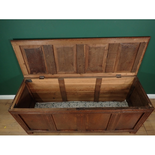 13 - An antique oak and elm Coffer with four panelled top and panelled top on squared supports, 5ft W