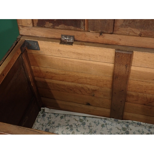 13 - An antique oak and elm Coffer with four panelled top and panelled top on squared supports, 5ft W