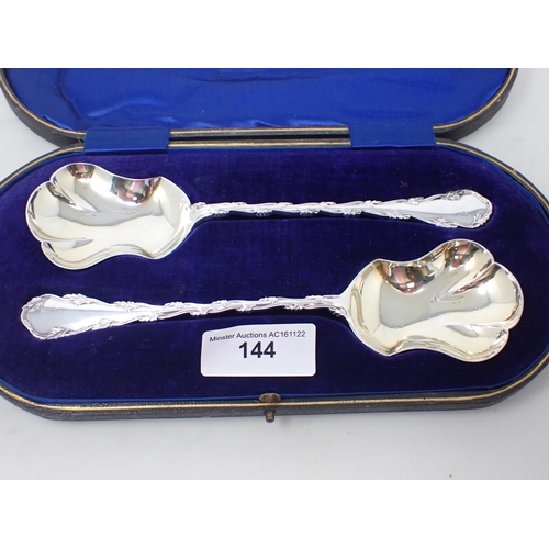 144 - A pair of George V silver Serving Spoons with fancy stems, Sheffield 1914, in case