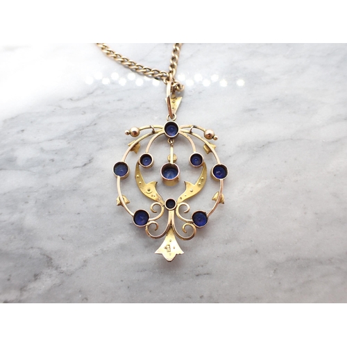 159 - A late 19th Century openwork Pendant set blue stones and seed pearls, marked 9ct on chain marked 9c,... 