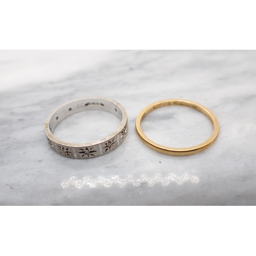 162 - A 22ct gold Wedding Band, approx 1.85gms and an 18ct white gold Diamond Eternity Ring pavé-set eight... 