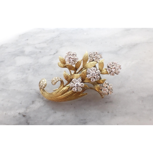 180 - A Diamond Flower Spray Brooch the six flower heads each claw-set seven brilliant-cut stones, eight-c... 