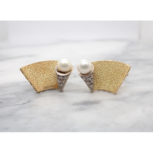 183 - A pair of Cultured Pearl and Diamond Cufflinks each with curved plaque with cone to one side pavé-se... 