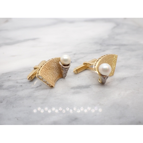 183 - A pair of Cultured Pearl and Diamond Cufflinks each with curved plaque with cone to one side pavé-se... 