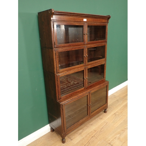 21 - A four tier oak glazed sectional Bookcase, 4ft 10