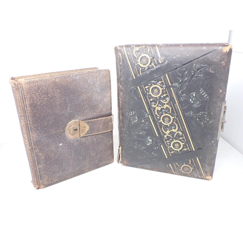 221 - A Victorian Photograph Album with embossed cover containing family portraits, etc, and a smaller Alb... 