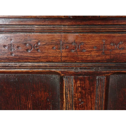 29 - A Late 17th Century oak Settle with panel back with punch work decoration on turned supports, 6ft 3