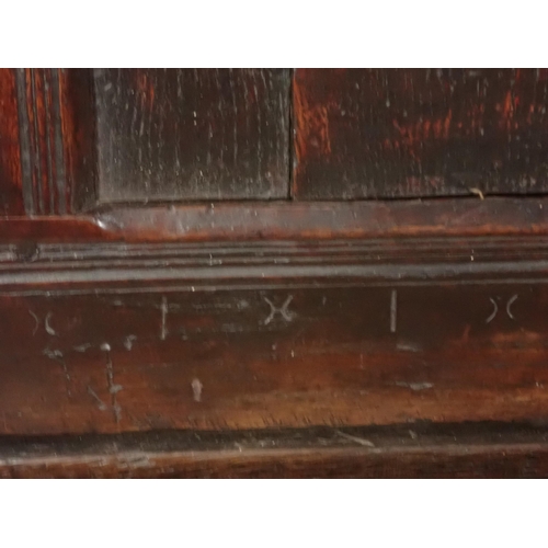 29 - A Late 17th Century oak Settle with panel back with punch work decoration on turned supports, 6ft 3