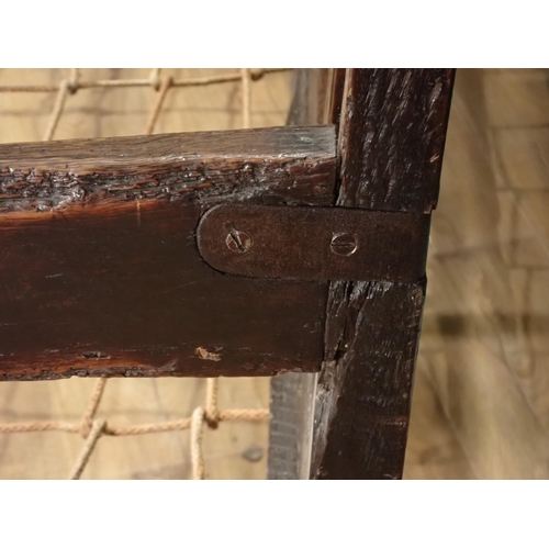 29 - A Late 17th Century oak Settle with panel back with punch work decoration on turned supports, 6ft 3