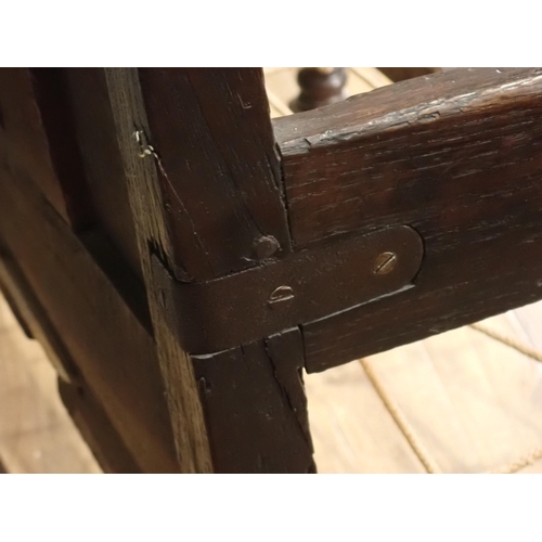 29 - A Late 17th Century oak Settle with panel back with punch work decoration on turned supports, 6ft 3