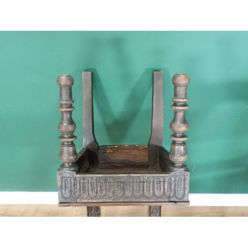 305 - A pair of carved oak Chairs with arched backs carved figures on turned supports