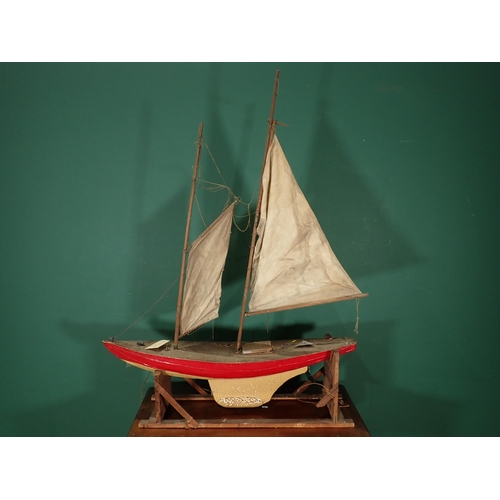 31 - *WITHDRAWN***A Pond Yacht on stand with two sails, 3ft 4in L A/F