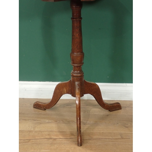 325 - A 19th Century oak Pillar Table with turned column and tripod base, 21in diam