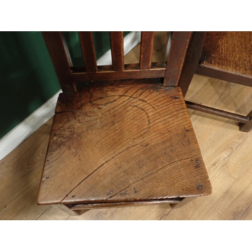 33 - A pair of antique oak Country stick back Kitchen Chairs