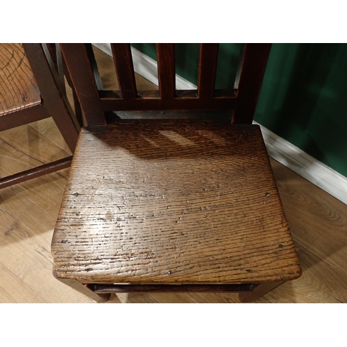 33 - A pair of antique oak Country stick back Kitchen Chairs