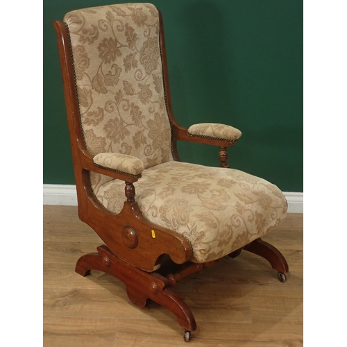 343 - A cream and floral upholstered Rocking Chair