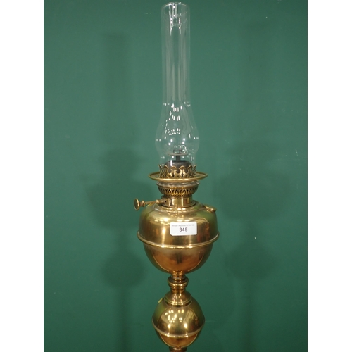 345 - A brass floor standing Oil Lamp, 5ft 6