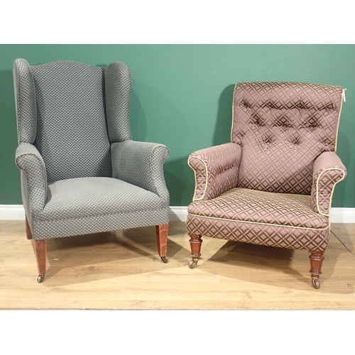 363 - A button upholstered Armchair with turned front supports and casters and a wing back Armchair with s... 