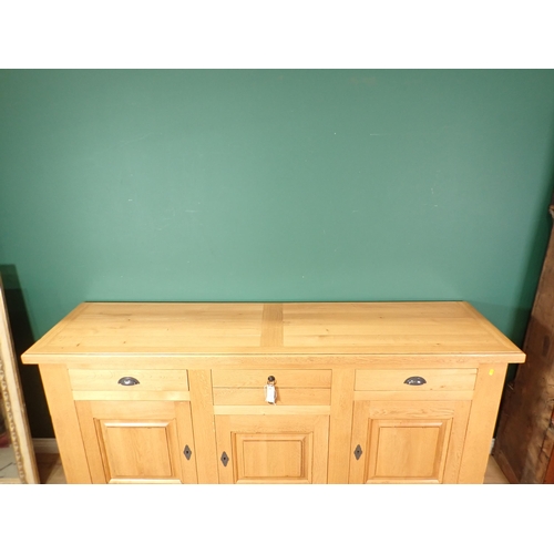 369 - A large modern oak Sideboard fitted drawers and cupboards on a plinth base, 6ft 10in W x 3ft 4in H x... 