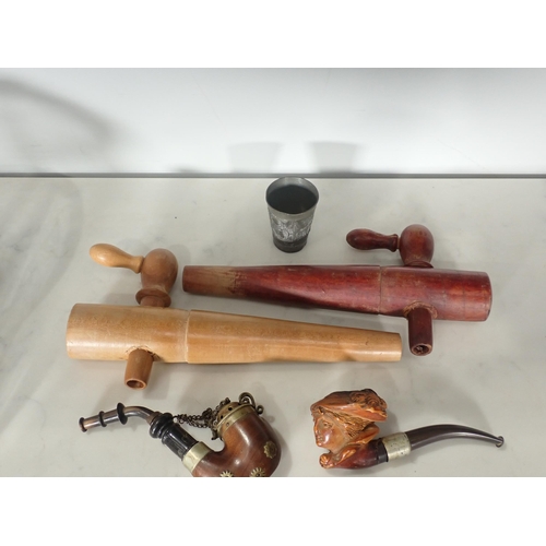 377 - A quantity of turned wooden items, barrel Taps, a Meerschaum Pipe, a Clay Pipe, etc