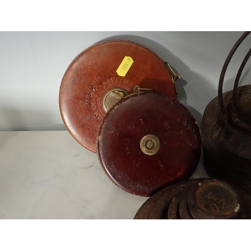 378 - A bell metal Pestle and Mortar, a cast iron Glue Pot, two leather covered Tape Measures, various Wei... 