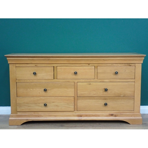 387 - A modern oak Chest of drawers on low bracket supports, 5ft W x 2ft 6in H