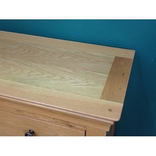 387 - A modern oak Chest of drawers on low bracket supports, 5ft W x 2ft 6in H