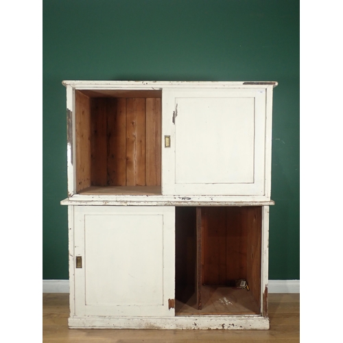 394 - A white painted pine Cupboard with two pairs of sliding doors on plinth base, 5ft H x 4ft 2in W