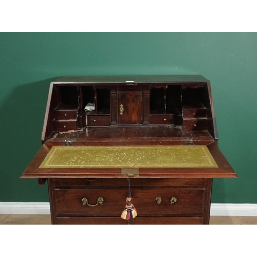 398 - A 19th Century mahogany Bureau the fall down above two short and three long drawers on ogee bracket ... 