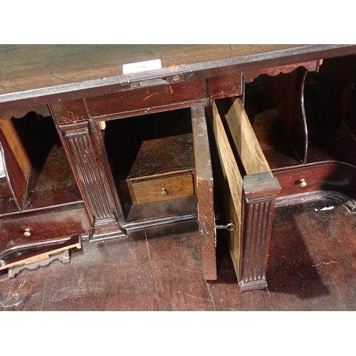 398 - A 19th Century mahogany Bureau the fall down above two short and three long drawers on ogee bracket ... 