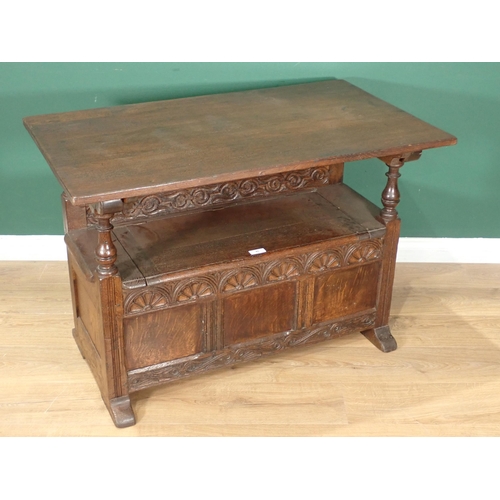 45 - A carved oak Monk's Bench with folding top, 3ft 6in W