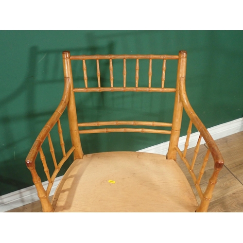 47 - ***WITHDRAWN***A carved Elbow Chair with cane seat and a simulated bamboo Elbow Chair