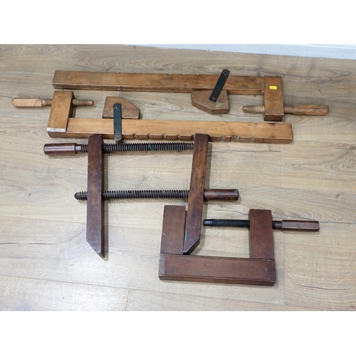 486 - A pair of long treen Clamps and two others