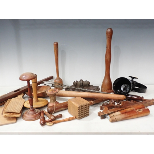 487 - A quantity of treen items including butter pats, Kitchen utensils, weaving tools etc