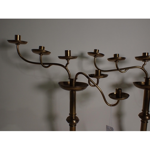 59 - A pair of 19th Century brass five light Church waterfall Candlesticks with single knop columns on ci... 