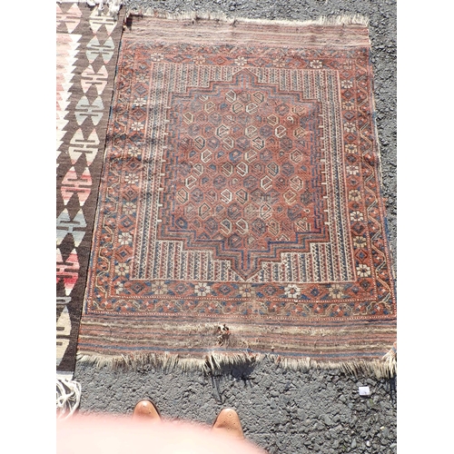 69 - An old bordered Shirvan Rug with stepped medallion containing botch, 4ft 4in x 3ft 4in, and two brig... 