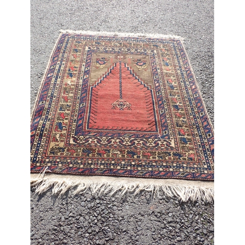 70 - A bordered Persian Prayer Rug, the stepped mihrab with hanging lantern on a brick and camel ground, ... 