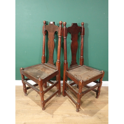 717 - A pair of antique oak Hall Chairs with vase splat backs, solid seats on turned and squared supports