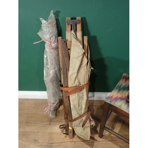 720 - A painted Luggage Stand, a folding Camp Bed, a tapestry Frame, a small carved Stool and a Dressing S... 