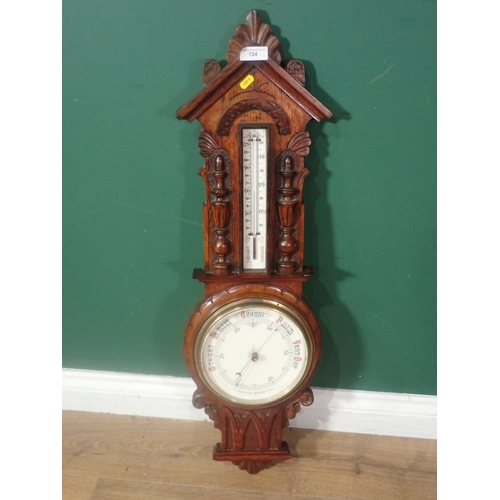 724 - A carved oak Aneroid Barometer, Thermometer, 2ft 11in H