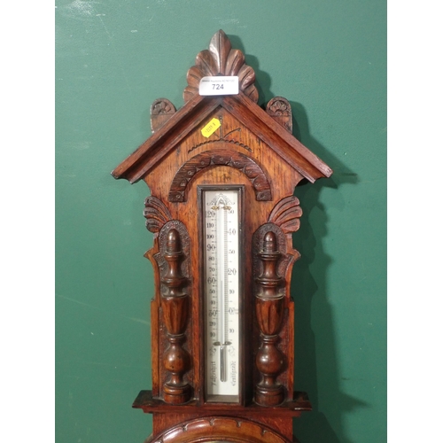 724 - A carved oak Aneroid Barometer, Thermometer, 2ft 11in H